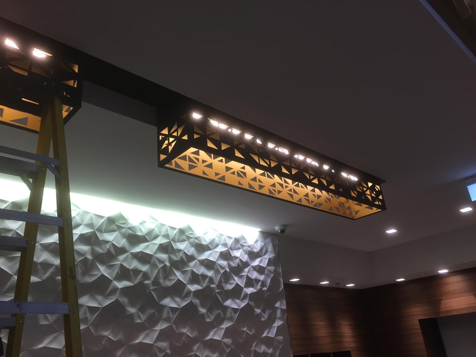 Calgary commercial electrician custom decorative light fixture feature wall installation