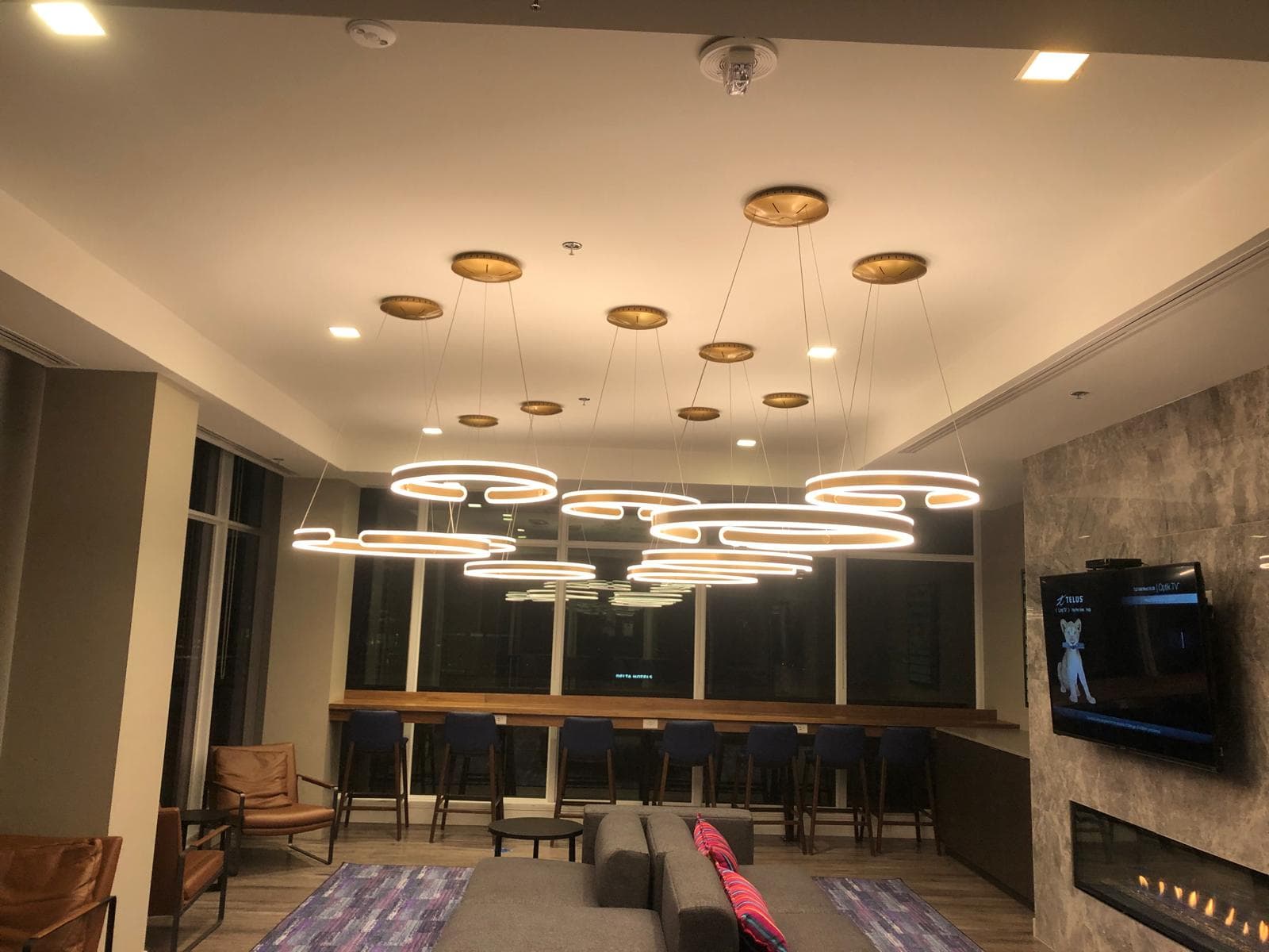 Calgary electrician condo amenity lounge LED ring pendant chandelier installation