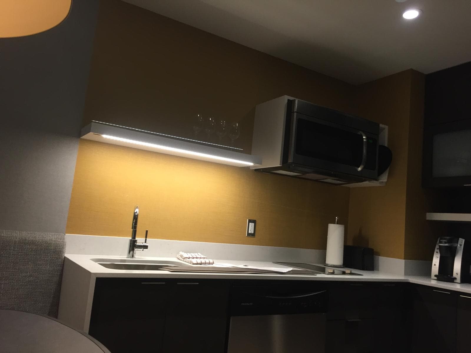 Calgary electrician hotel suite under-cabinet LED strip lighting installation